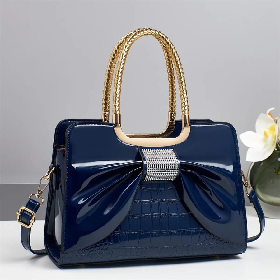 Navy patent bow satchel with gold handles