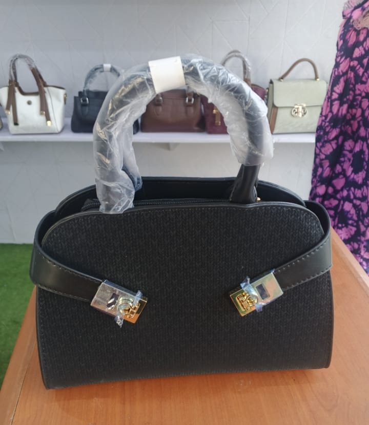 Black frame satchel with twin gold locks